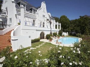 Exterior view of the 337-year-old Stillness Manor featuring Cape Dutch-style architecture in South Africa